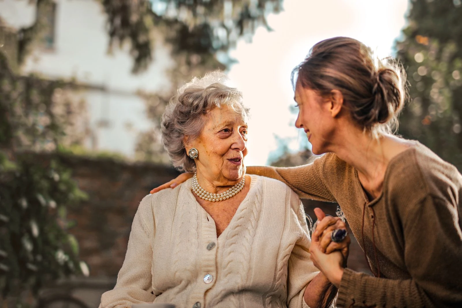 An adult daughter spending time with her elderly mother