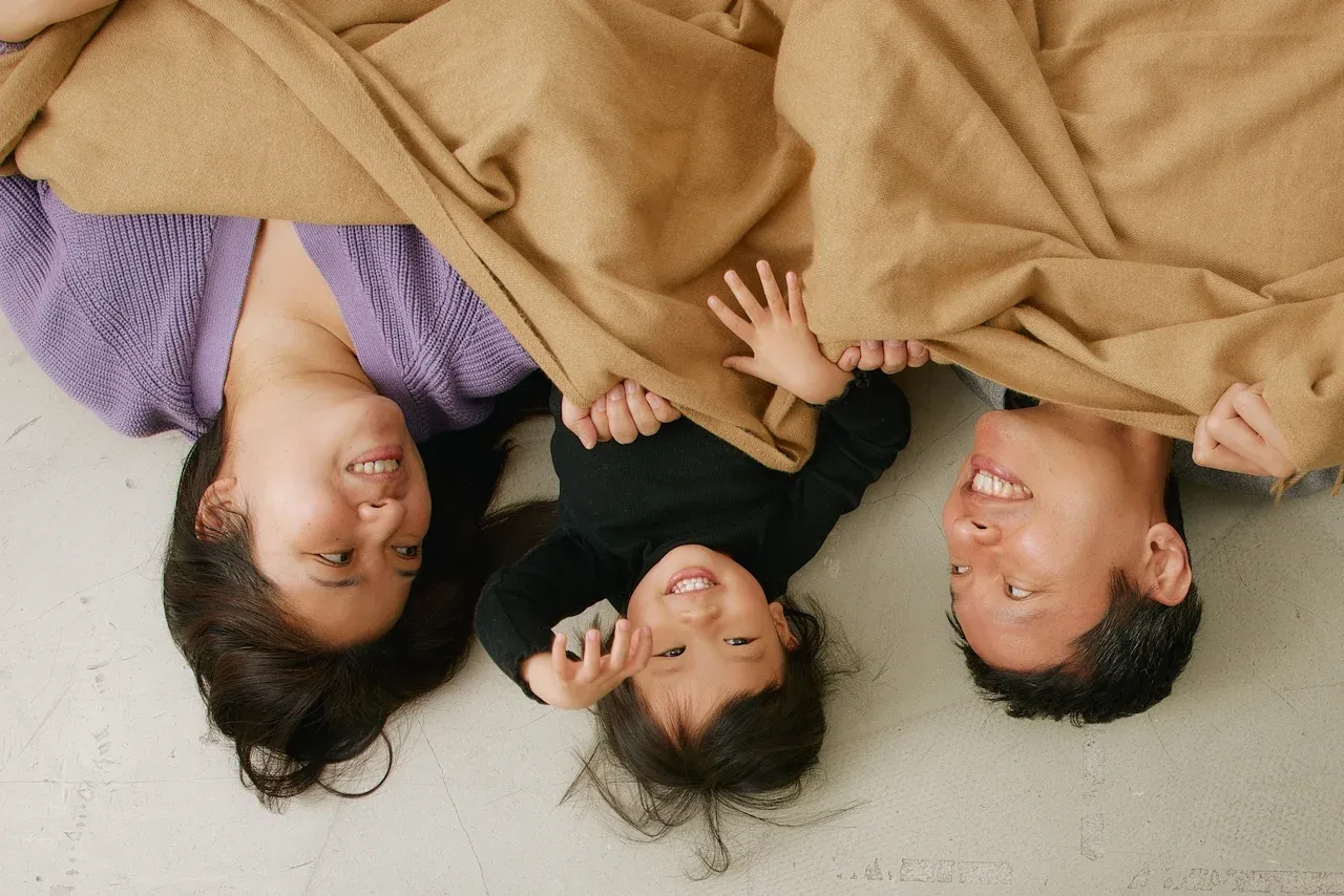 Parents and their child sharing a playful family moment
